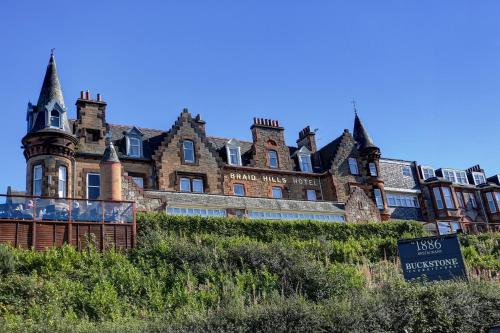 an old building with a sign in front of it at Braid Hills Hotel in Edinburgh