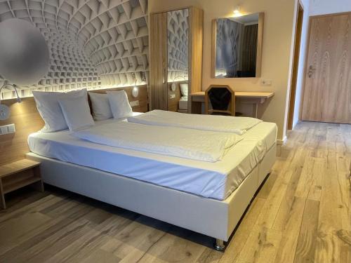 Postel nebo postele na pokoji v ubytování Hotel Andrea