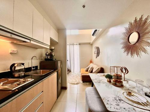 a kitchen with a sink and a counter top at CC Loft in Mandurriao