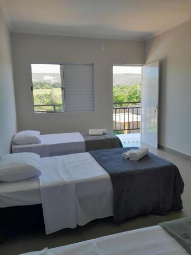Ένα ή περισσότερα κρεβάτια σε δωμάτιο στο Pousada Casa Vista Bela São José da Barra Capitólio