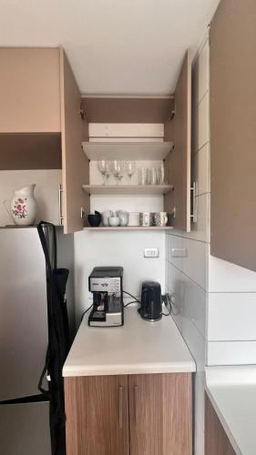 a kitchen with a counter with a toaster on it at Cabaña del Llicanko in Achao