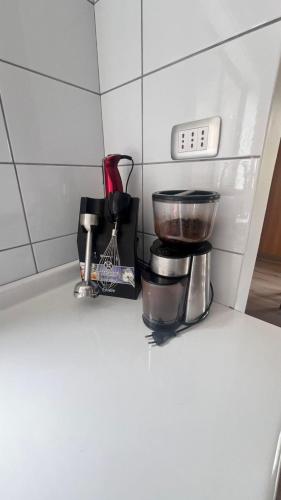a coffee maker on a counter in a kitchen at Cabaña del Llicanko in Achao