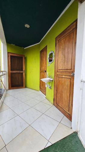 an empty room with a sink and a door at Hotel Restaurante Los Cocos in Santa Cruz