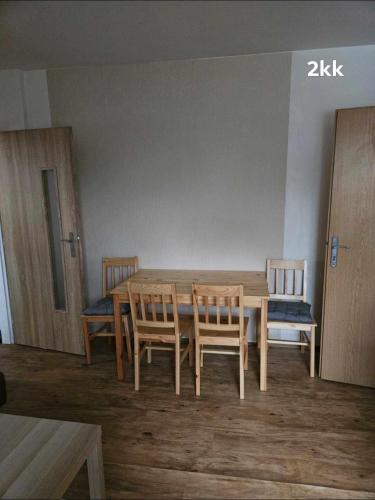 a wooden table and chairs in a room at Ubytování v soukromí in Choustníkovo Hradiště