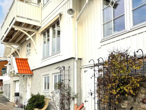 a white house with an orange roof at 5 star holiday home in Uddevalla in Sundsandvik