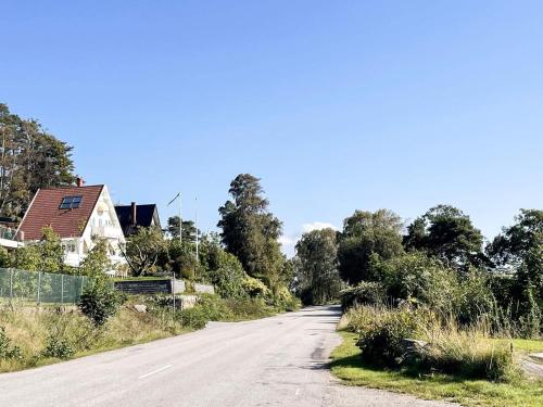 an empty road with a house on the side at 5 star holiday home in Uddevalla in Sundsandvik