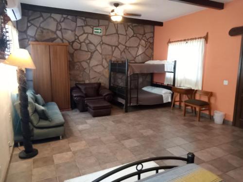Ένα ή περισσότερα κρεβάτια σε δωμάτιο στο Hacienda De Palmas
