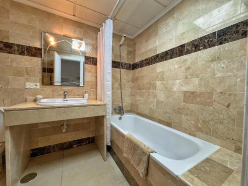 a bathroom with a sink and a bath tub at Heavenly Homes Mojacar 73 in Mojácar