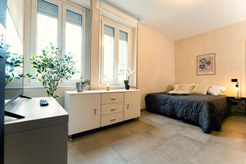 Ένα ή περισσότερα κρεβάτια σε δωμάτιο στο Residence La Corte - Bilocale 1