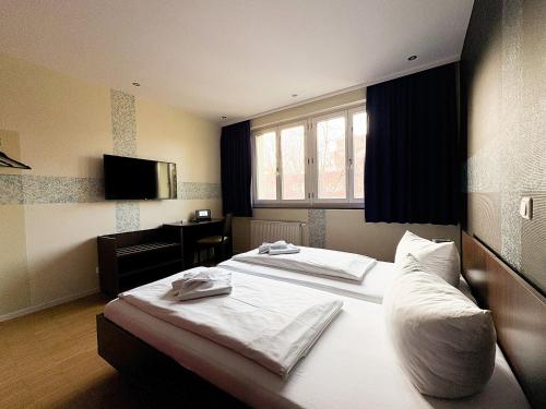 Postel nebo postele na pokoji v ubytování HOLI City Apart Hotel Berlin