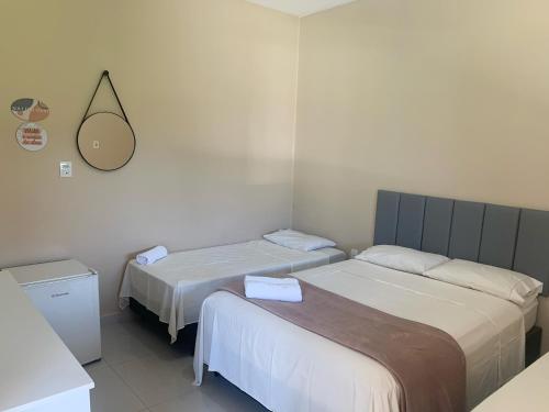 En eller flere senge i et værelse på Refúgio do Bosque