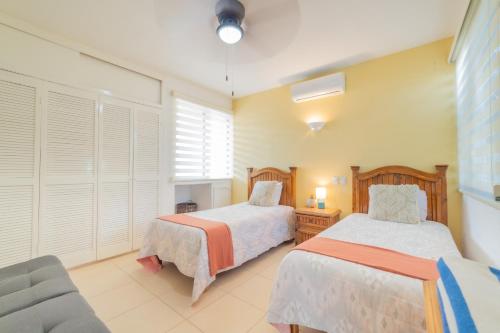 Ένα ή περισσότερα κρεβάτια σε δωμάτιο στο GoBaja Villas 2 bedroom