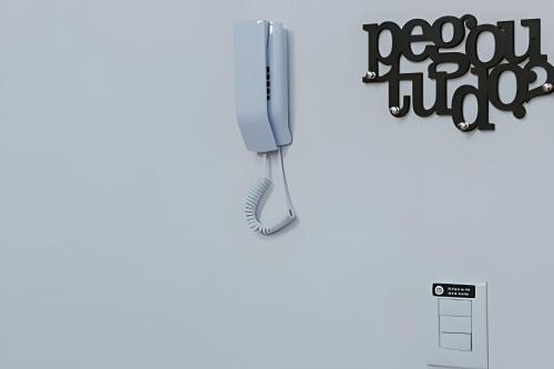 a brush hanging from a hook on a wall at Mini Loft Siena in Sinop
