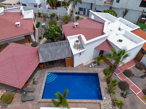 an aerial view of a house with a swimming pool at GoBaja Villas 2 bedroom in La Paz