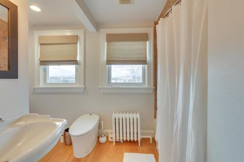 a bathroom with a white toilet and a sink at Walk to Roanoke River Greenway Mountain-View Home in Roanoke