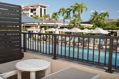 a view of the pool from the balcony of a resort at Maui Coast Hotel in Kihei