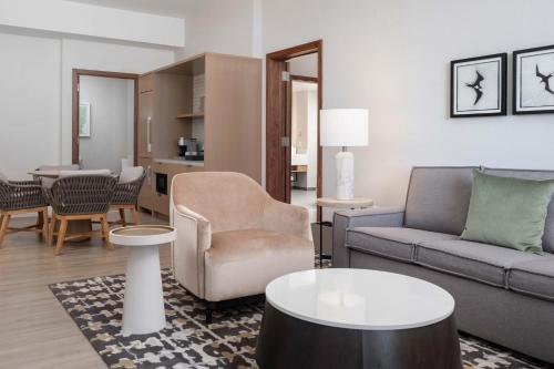 a living room with a couch and a table at Maui Coast Hotel in Kihei