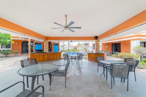 a patio with tables and chairs and a kitchen at Go Baja Villas 2 Bedroom (King) in La Paz