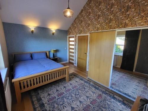 a bedroom with a bed in a room with a window at Anchor Gardens Villa in Lindal in Furness