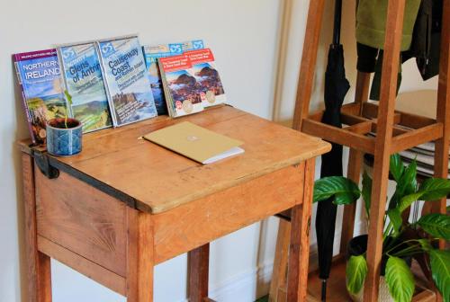 a wooden table with a laptop on top of it at Peatlands in Ballybogy