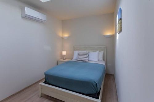 Ένα ή περισσότερα κρεβάτια σε δωμάτιο στο Dutch Caribbean Residence F