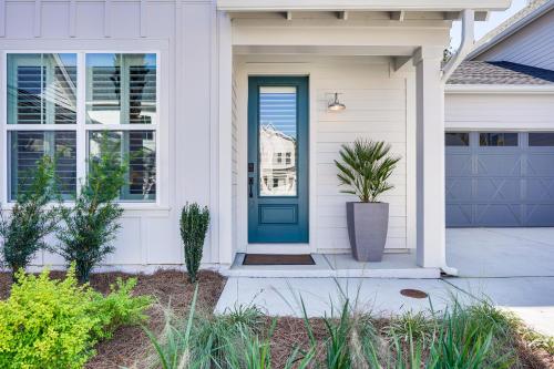 a front door of a house with a blue door at Historic Location Townhome in Johns Island! in Johns Island