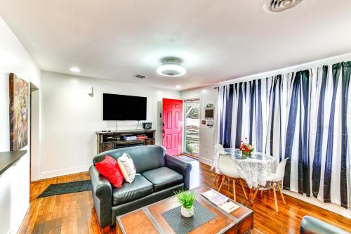 a living room with a couch and a table at Charming Laurel Home with Gazebo and Fireplace! in Delmar