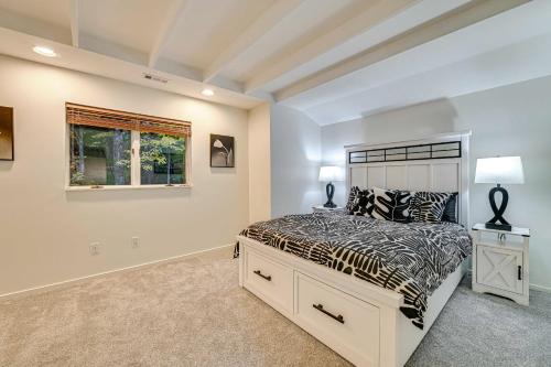 a bedroom with a bed and a window at 2 Mi to Six Flags Lake George Home with Large Patio in Queensbury