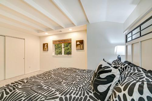 a zebra print bed in a room with a window at 2 Mi to Six Flags Lake George Home with Large Patio in Queensbury