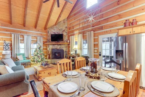 a dining room and living room with a wooden ceiling at Hot Tub and Games Ridgetop Cabin in Blue Ridge! in Blue Ridge
