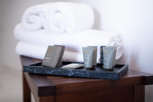 a black tray with three candles on a table at Hotel de Sal Luna Salada in Colchani
