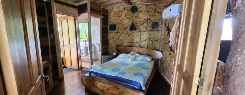 Postel nebo postele na pokoji v ubytování Hotel Cabaña Guainiana