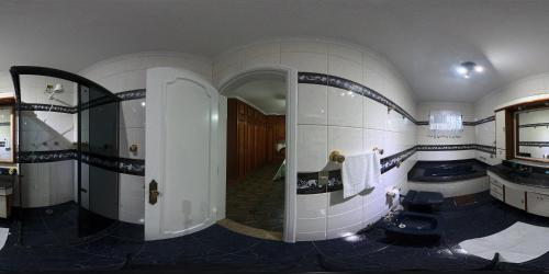 a bathroom with a toilet and a sink at Hostel Blaese Pascal - HBP in Guarulhos
