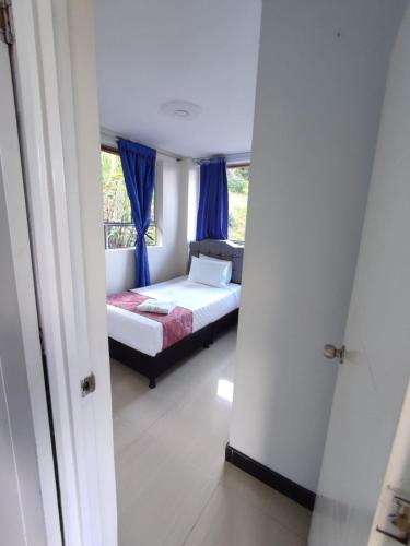 a bedroom with a bed and a window at Hotel kristal campestre in San Francisco