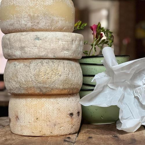 a stack of rocks next to a pile of vases at B&B Al Felcino in Fabro