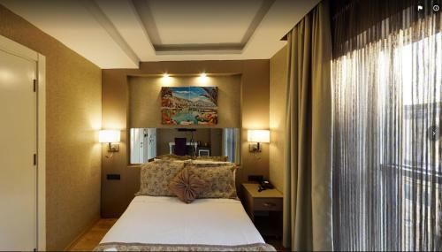 Katil atau katil-katil dalam bilik di Hotel Iz