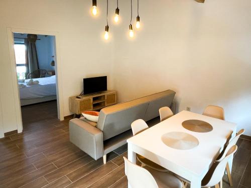 a living room with a table and a dining room at Casa Barracuda in Faja Grande