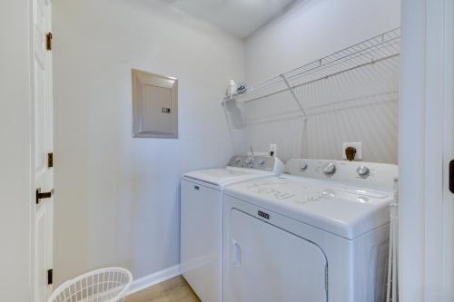 a white washer and dryer in a white bathroom at Easy Access to Dtwn High Point Condo in High Point
