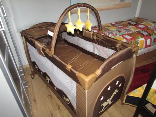 a childs bed with a wooden frame in a room at FeWo Harz Haennig 1 in Wieda