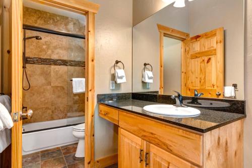 a bathroom with a sink and a shower at KBM Resorts Timber Wolf Lodge Walk to Canyons Cabriolet Fireplace BBQ Aspens Creek Parking TWL-12c in Park City