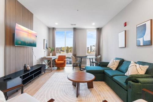 a living room with a couch and a table at Near Fishtown and Old City - King Bed - City Views in Philadelphia