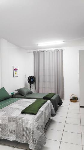 Ένα ή περισσότερα κρεβάτια σε δωμάτιο στο Pouso Del Rei - Melhor custo benefício no centro da cidade