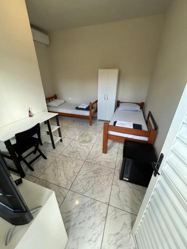 Ένα ή περισσότερα κρεβάτια σε δωμάτιο στο Pousada Quartos vcp