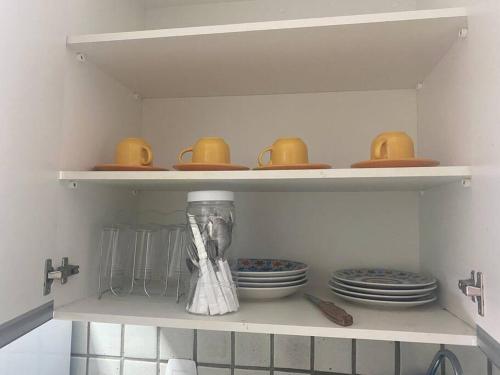 Cuisine ou kitchenette dans l'établissement Sua casa na Ponta Verde 200m da praia