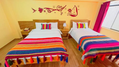 Postel nebo postele na pokoji v ubytování Andean Atoq Hostel