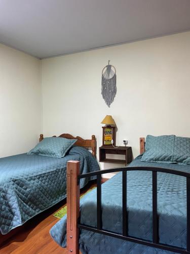 Una cama o camas en una habitación de Cabaña Curacautín “Refugio Cautin”