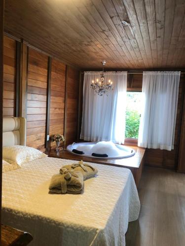 Postel nebo postele na pokoji v ubytování Chalé Recanto do Pimenta e Casa Recanto do Pimenta