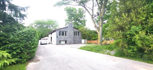 a stone house on the side of a road at Cozy Home in Niagara-on-the-Lake in Niagara on the Lake