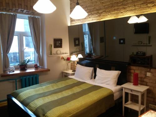 Cama ou camas em um quarto em Lvovo Apartments