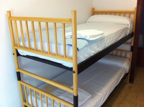 a couple of bunk beds in a room at Apartamentos Calle Mayor in Castellón de la Plana